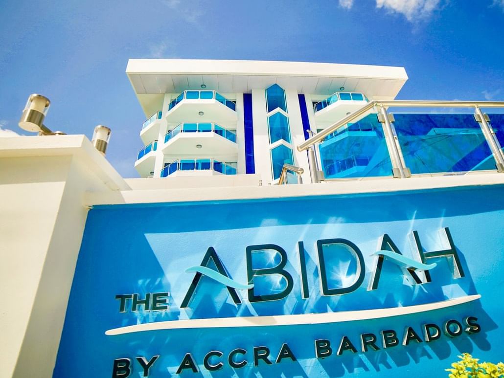 Hotel sign by the entrance of The Abidah by Accra Barbados