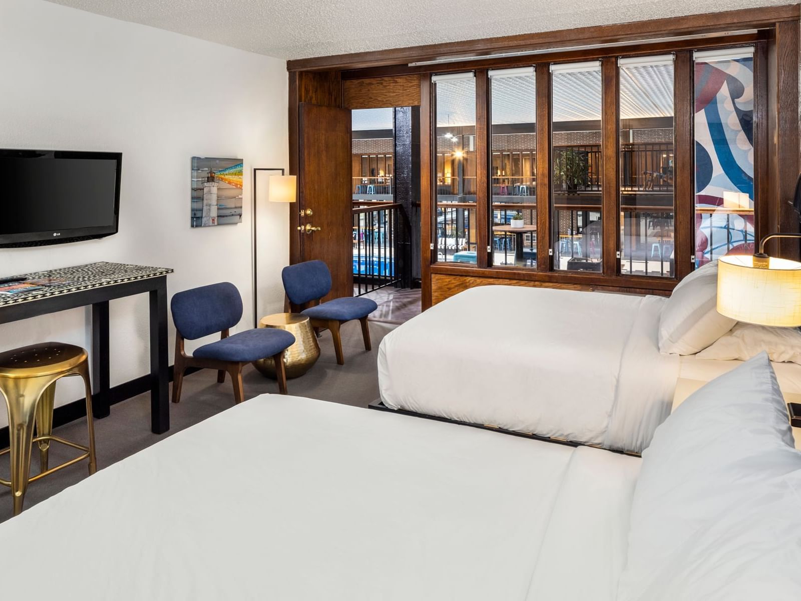 Two queen beds with view of indoor pool