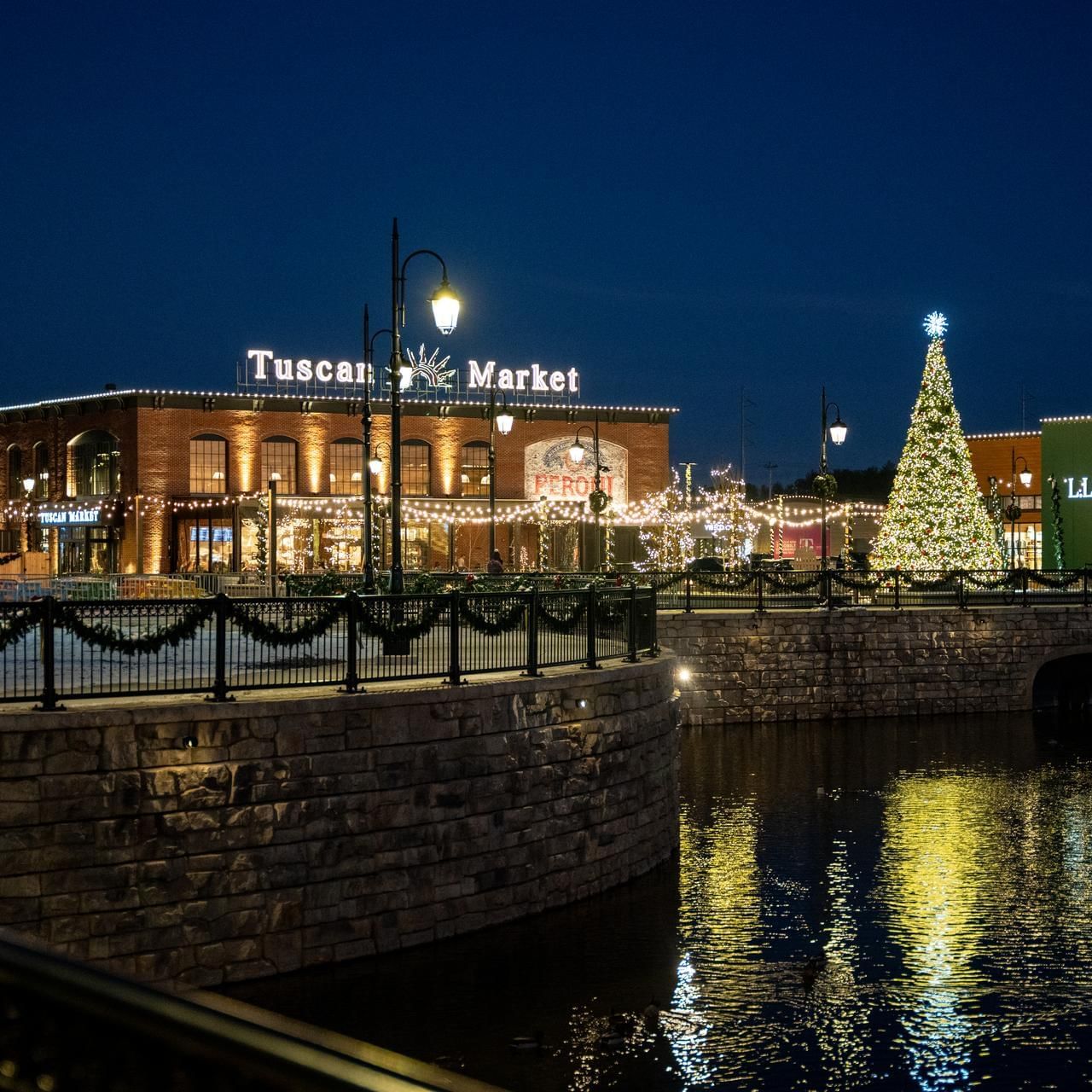 Illuminated Tuscan Market on Christmas Eve near The Artisan Hotel at Tuscan Village