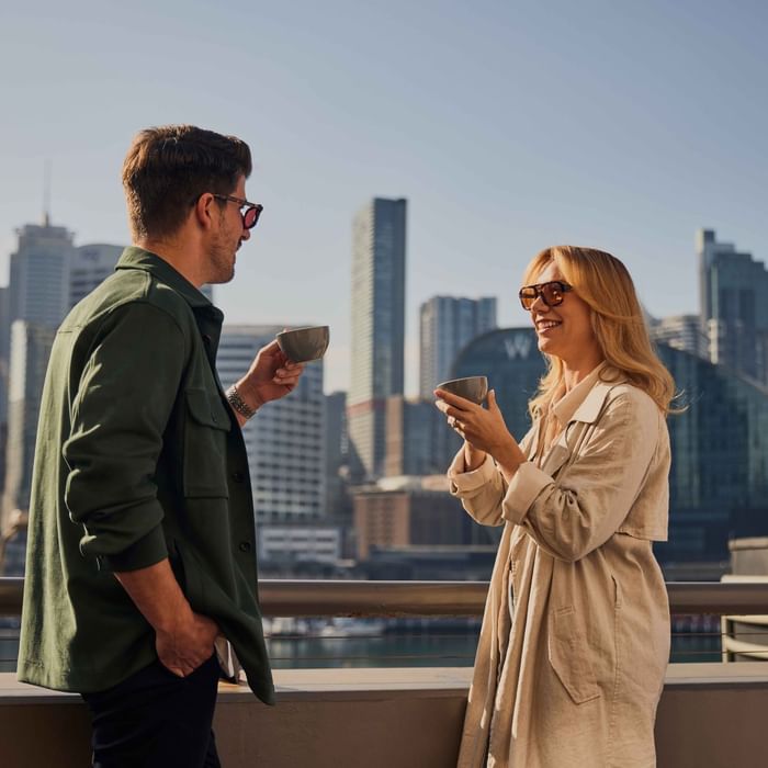 Couple enjoying sunset drinks on ibis bar deck