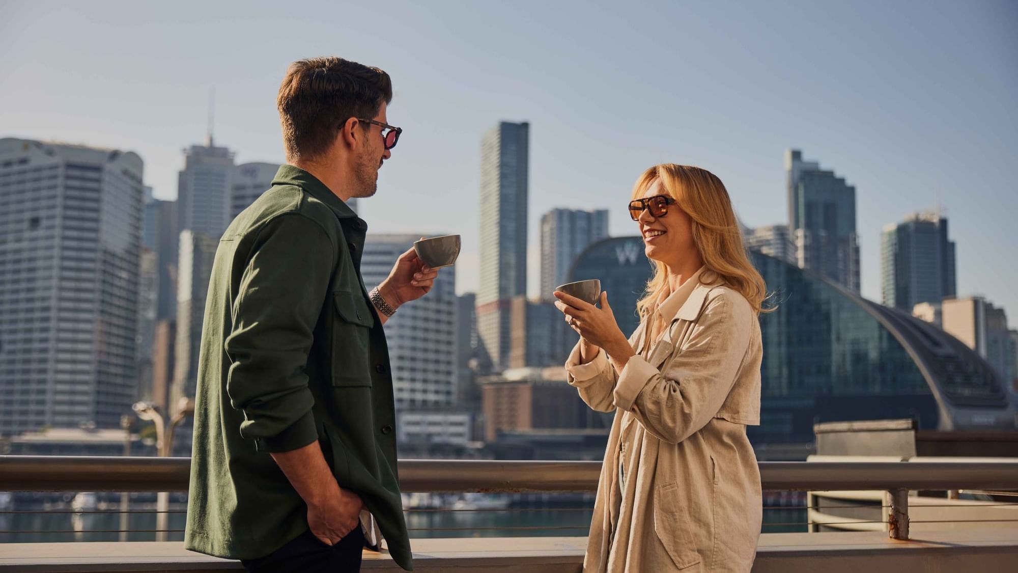 Couple enjoying sunset drinks on ibis bar deck