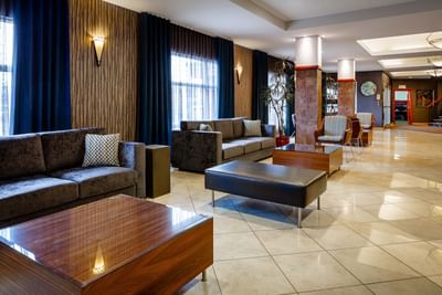 modern lobby of hotel with couches and tables