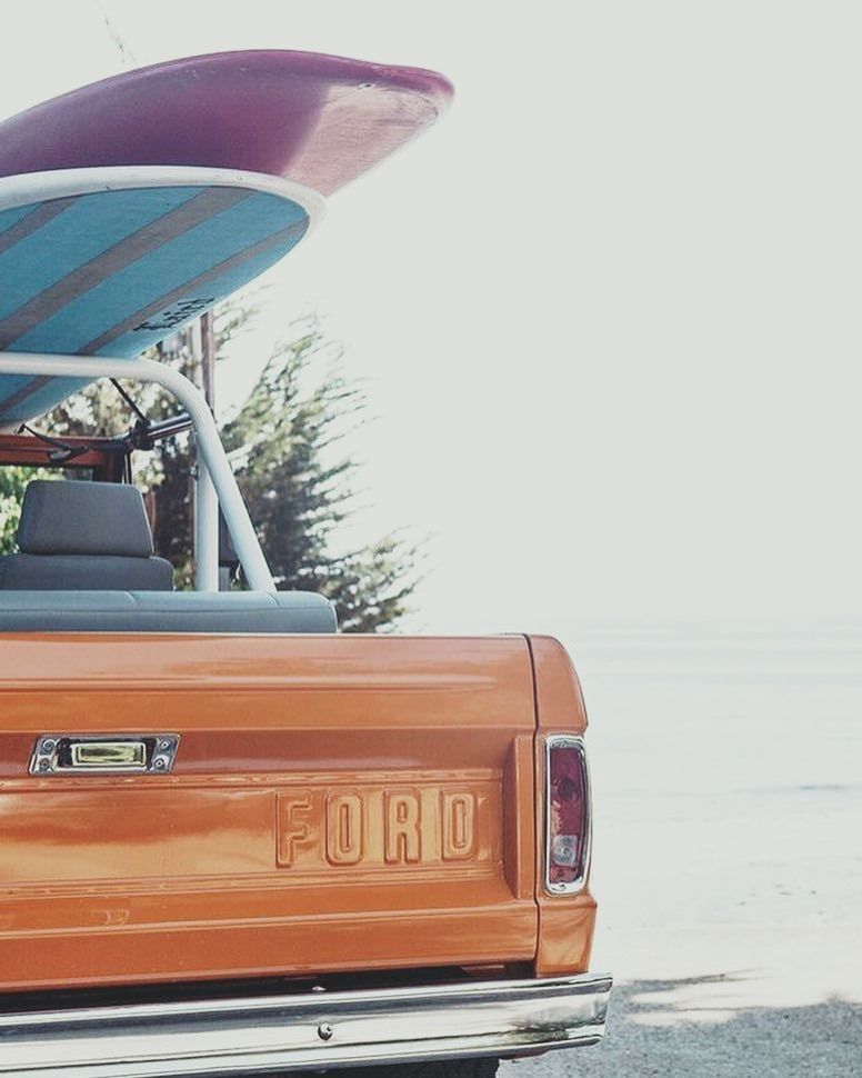 Car with surf boards near the ocean near Driftaway Hotel and Pool