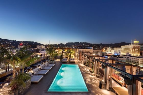 Pool area with pool chairs Drone view at Dream Hollywood.