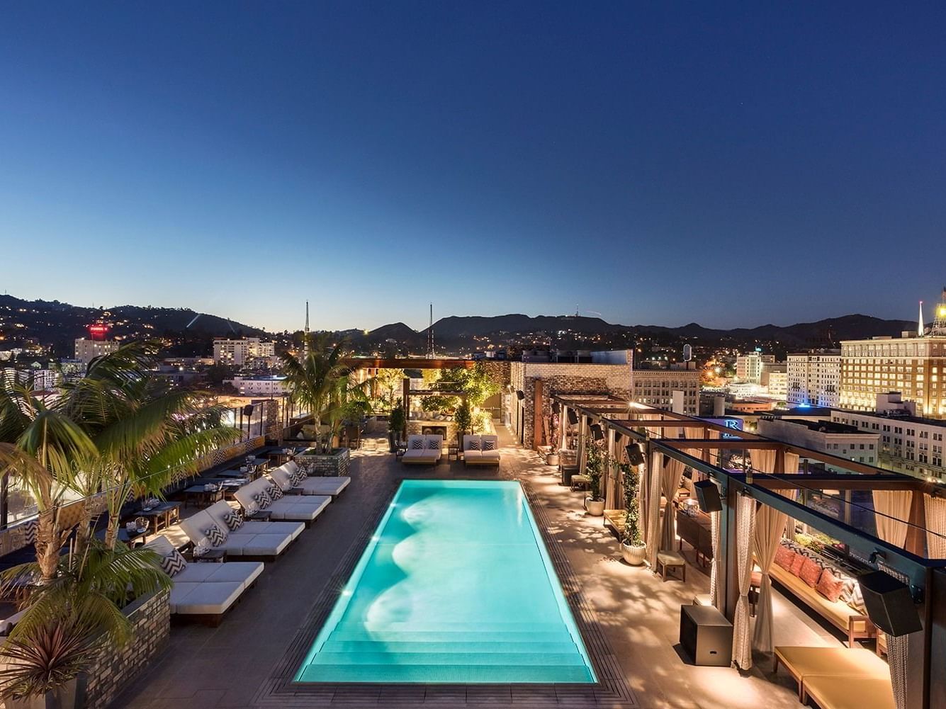 Pool area &chairs drone view at Dream Hollywood 