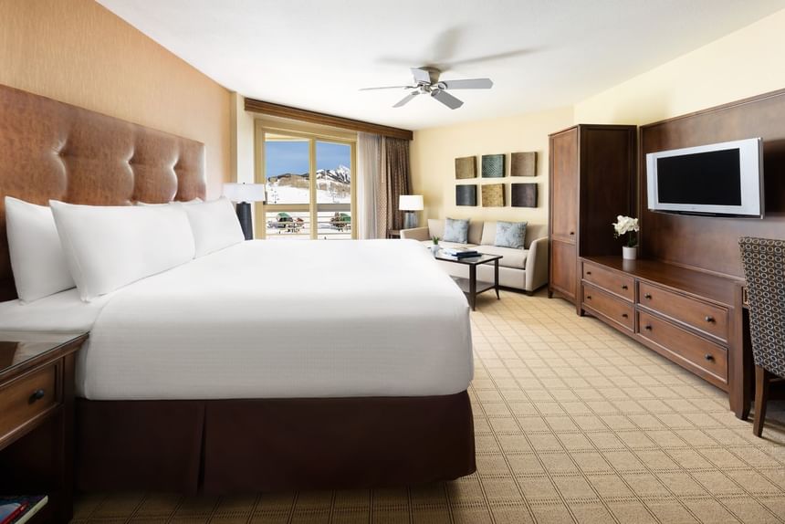 Elegant room with king-sized bed and scenic view at Elevation Resort Spa.