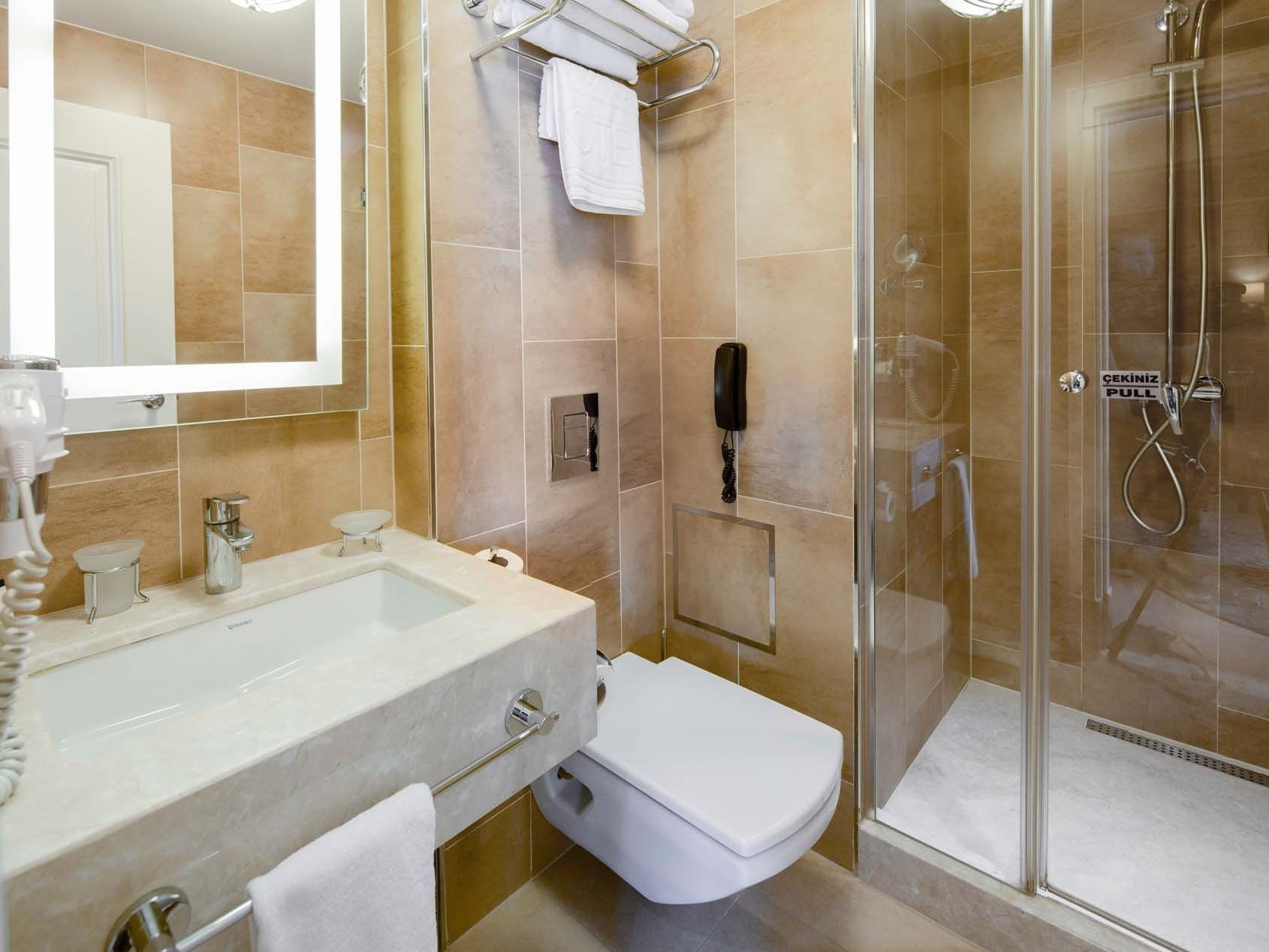 Bathroom interior with mirror and vessel sink in Superior Room at Titanic Comfort Sisli