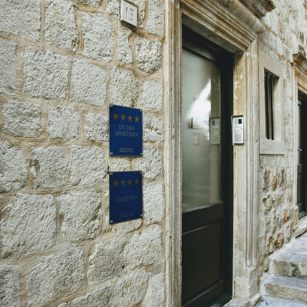 Exterior view of Celenga Apartments with stone walls