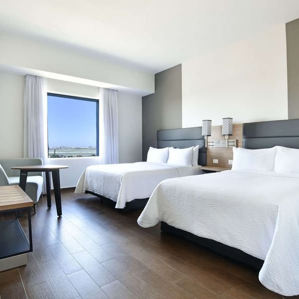 Twin beds in Double Plus Room at Fiesta Inn