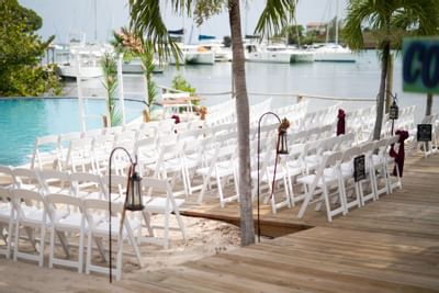 An outdoor wedding ceremony at True Blue Bay Hotel