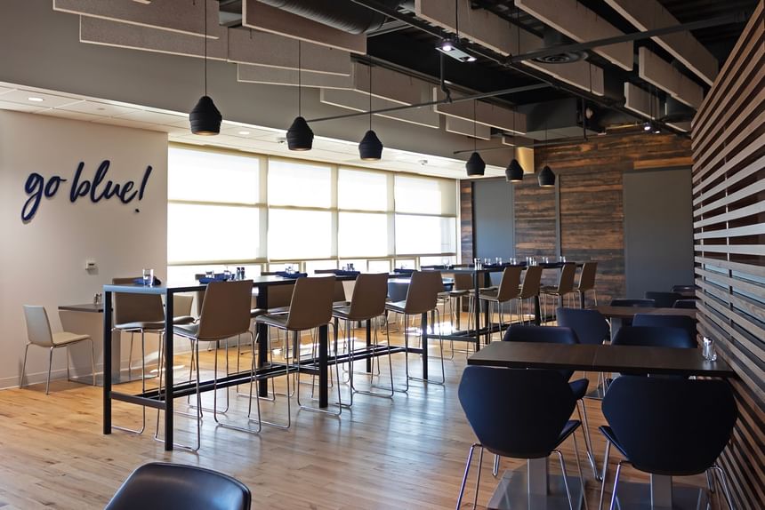  Michigan Ross cafeteria dining area with tables, chairs, and a 