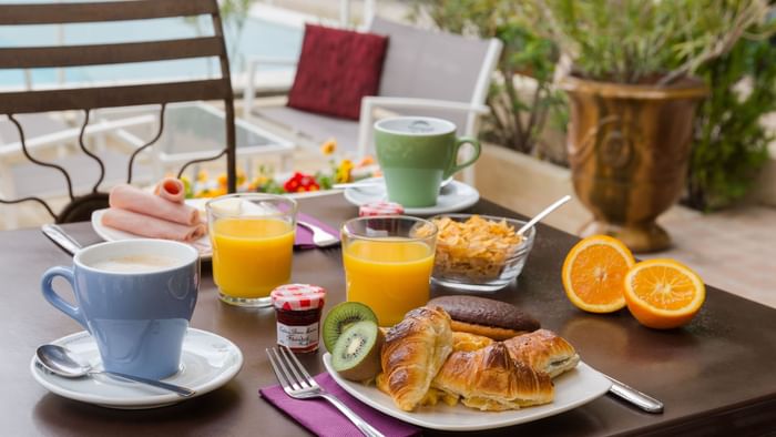 Close up on a table with food at Hotel Le Village Provencal
