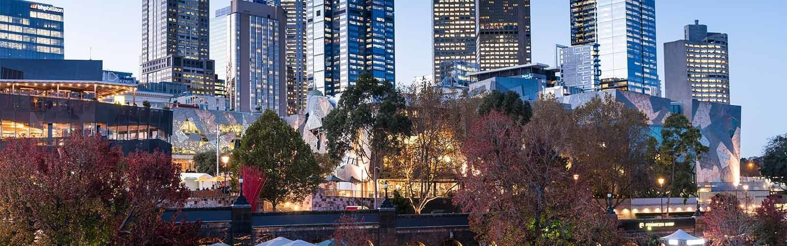 Lit buildings in the evening near Pullman Melbourne CBD