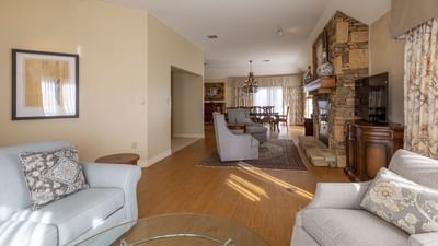 A picture of the living room, TV area, and the kitchen of the penthouse of the Music Road Inn.