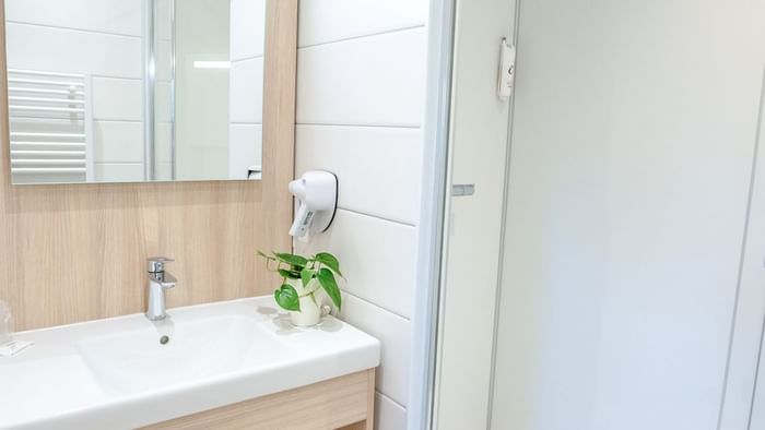 Bathroom vanity in bedrooms at Hotel Au Chene Vert