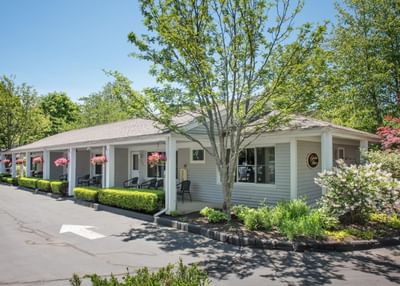 Exterior guest room building surrounded by landscaping at Anchorage By The Sea