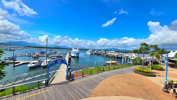 Wooden boardwalk leading to a Port Denarau Marina with various yachts and ferries near TokaToka Resort Nadi Fiji