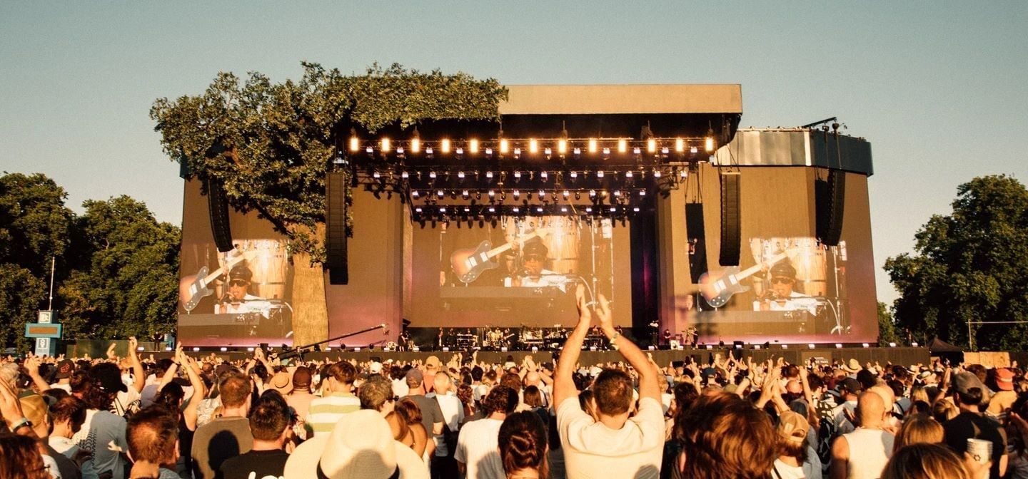 BST Hyde Park festival crowd near The Londoner Hotel, watching a major concert performance on a massive outdoor stage