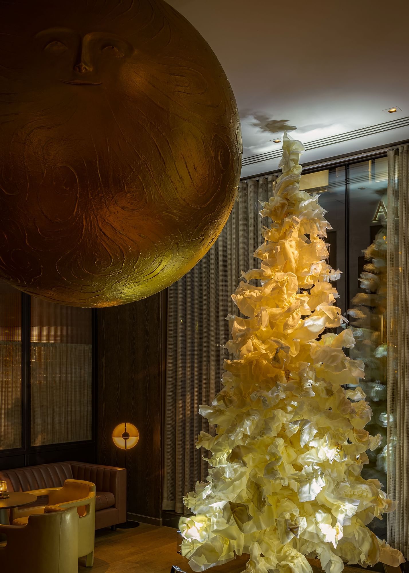Modern Christmas tree with deco in the lobby area at The Londoner