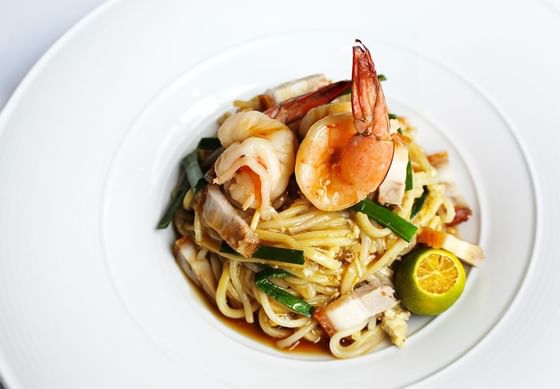 Closeup of a noodle & prawns dish at Amara Hotel Singapore