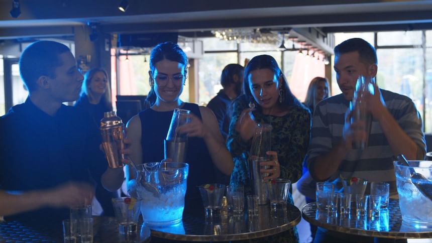 People making cocktails in the bar at Mont Gabriel Resort & Spa