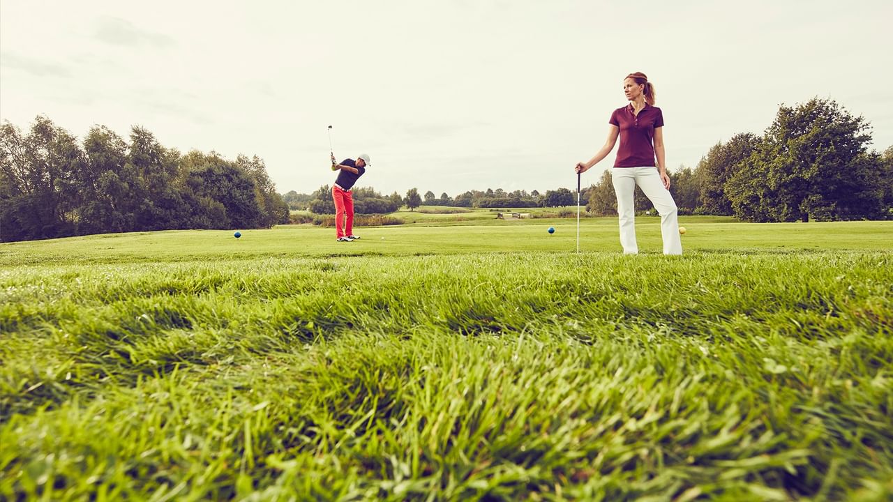 Two women playing golf at Whitecourt Golf & Country Club.