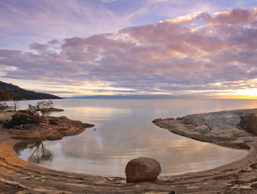 Landscape view of Honeymoon Bay at sunset near Freycinet Lodge