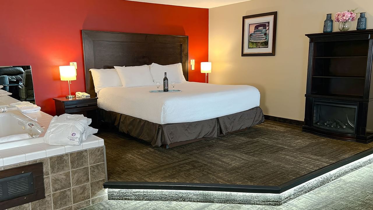 Jacuzzi tub and bed in hotel suite