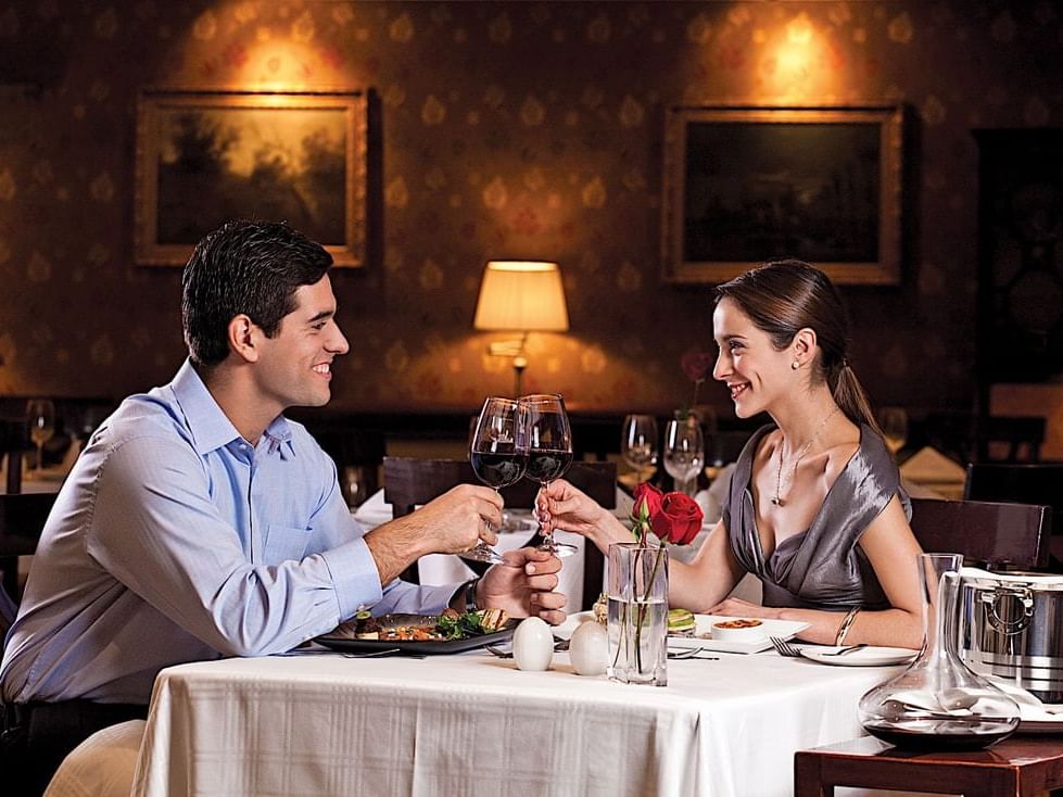 A couple enjoying dinner and wine at Hotel Plaza San Francisco