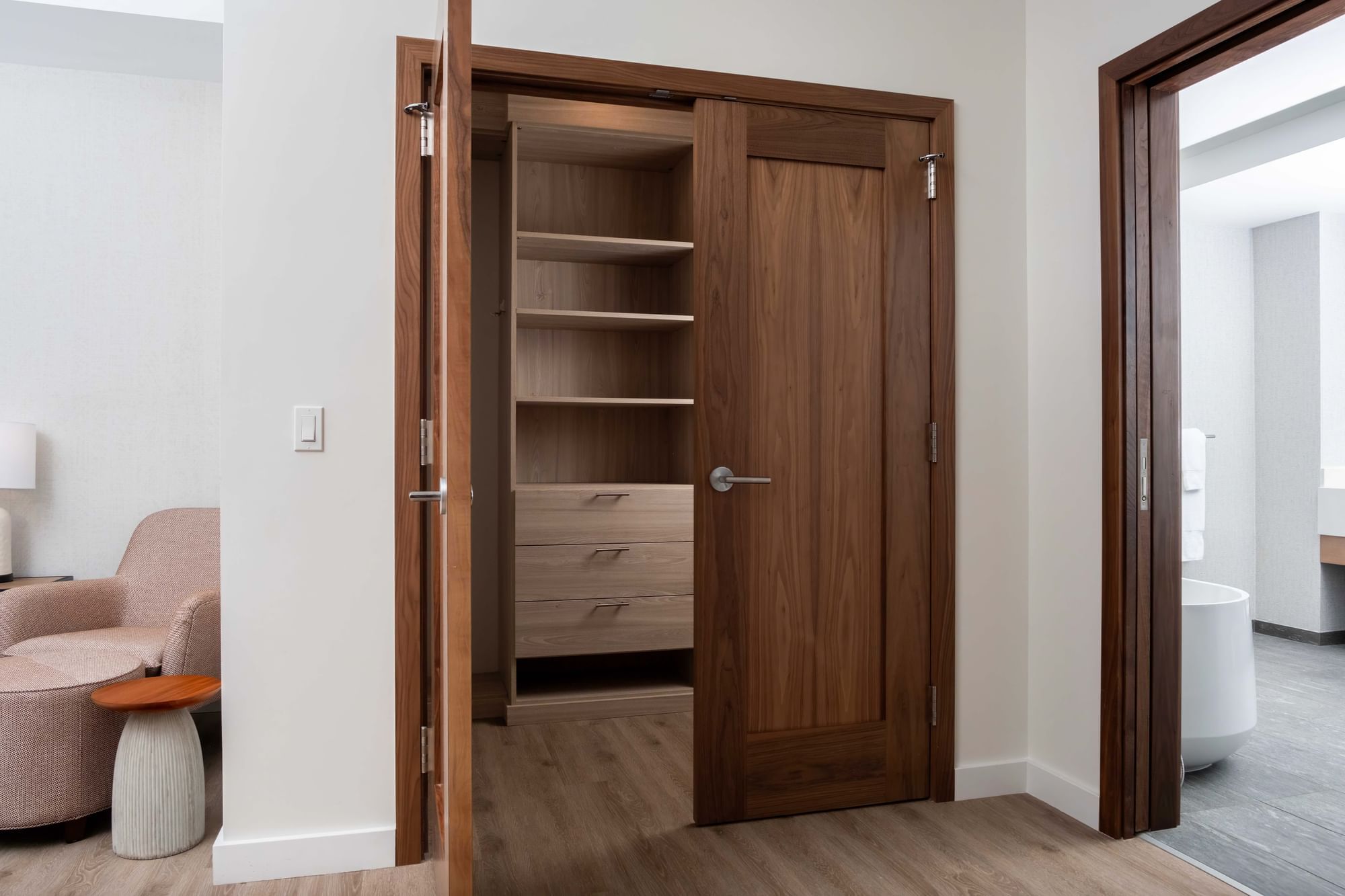 A room with a closet and a chair