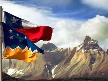 Flags of Texas & Bosnia by the mountain view near Hotel Cabo