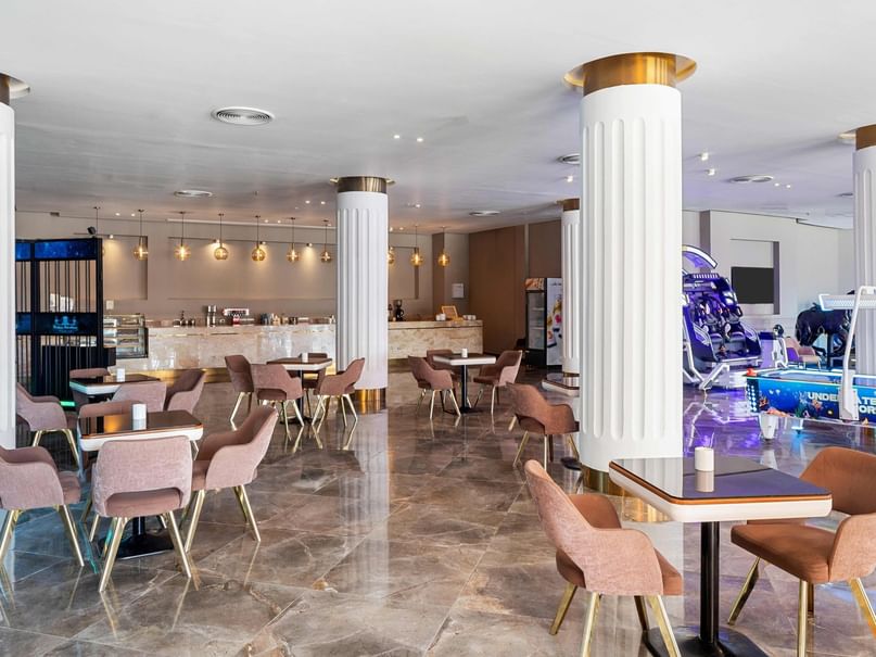 Elegant Colombus Bar interior with modern furniture and decor at Pickalbatros Jungle Aqua Park Resort - Neverland Hurghada.