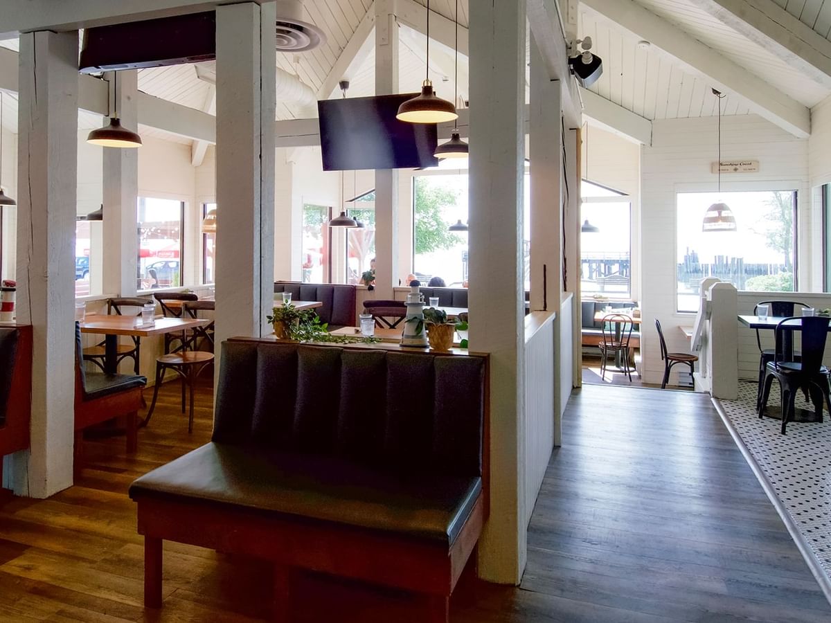 Interior of Joe's on the Beach with wooden floors, tables and chairs