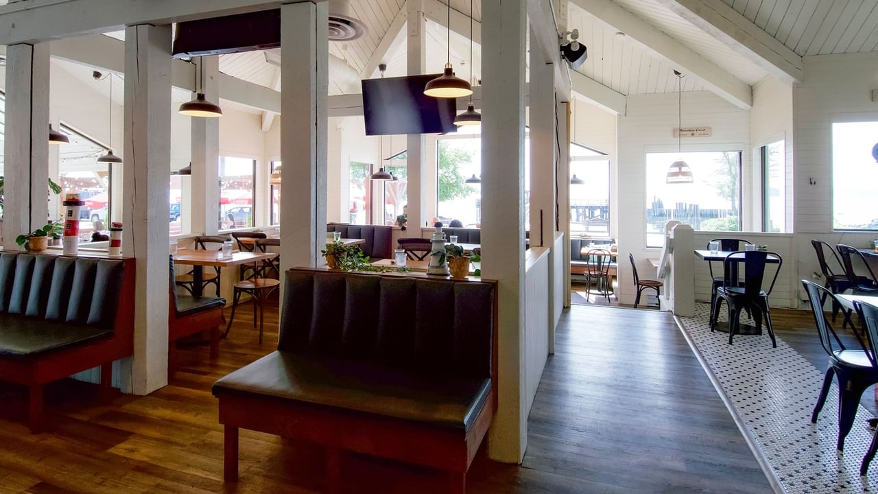 Interior of Joe's on the Beach with wooden floors, tables and chairs