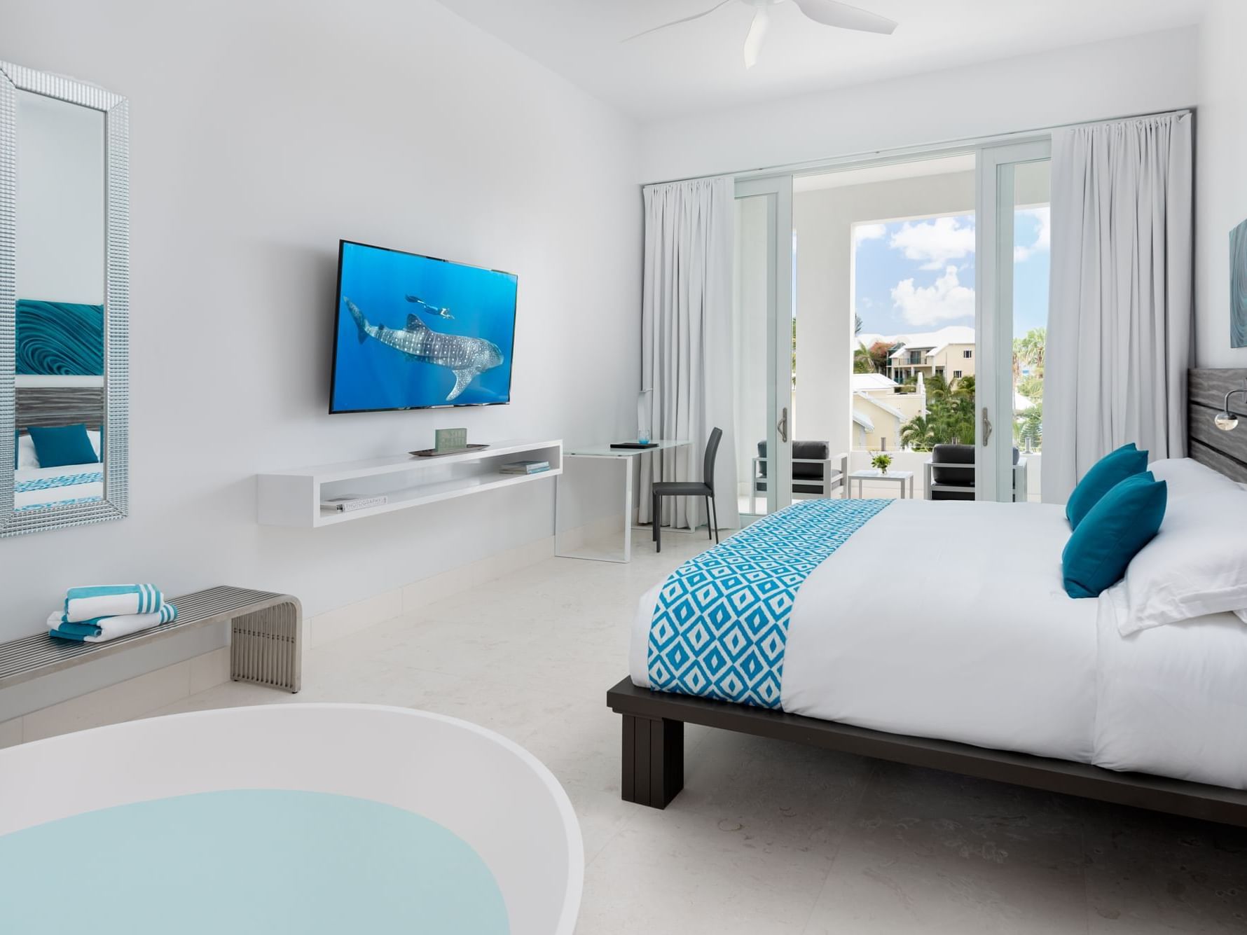 a bed and tub in a hotel room