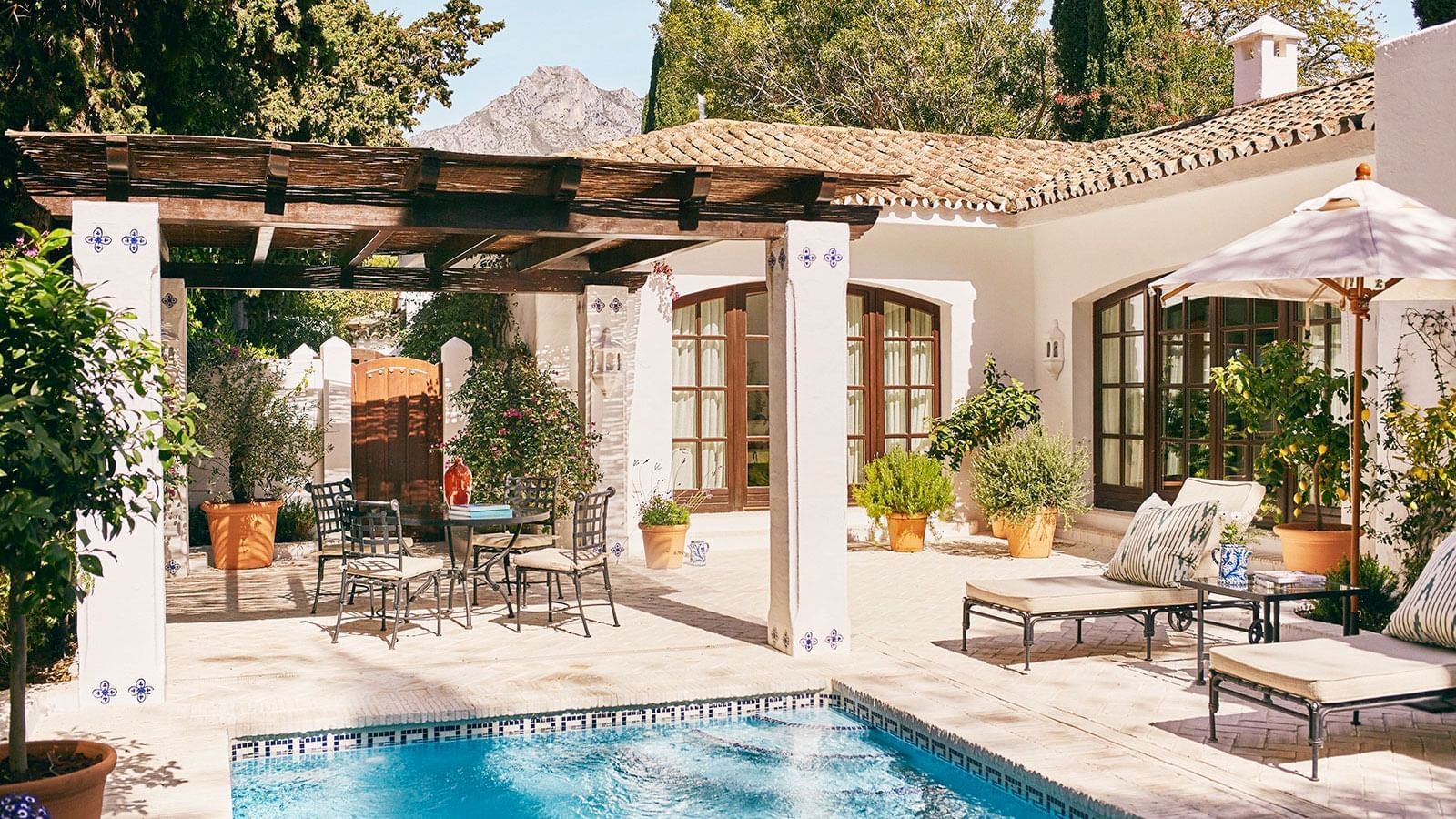 Dining by the pool in Two-Bedroom Bungalows at Marbella Club
