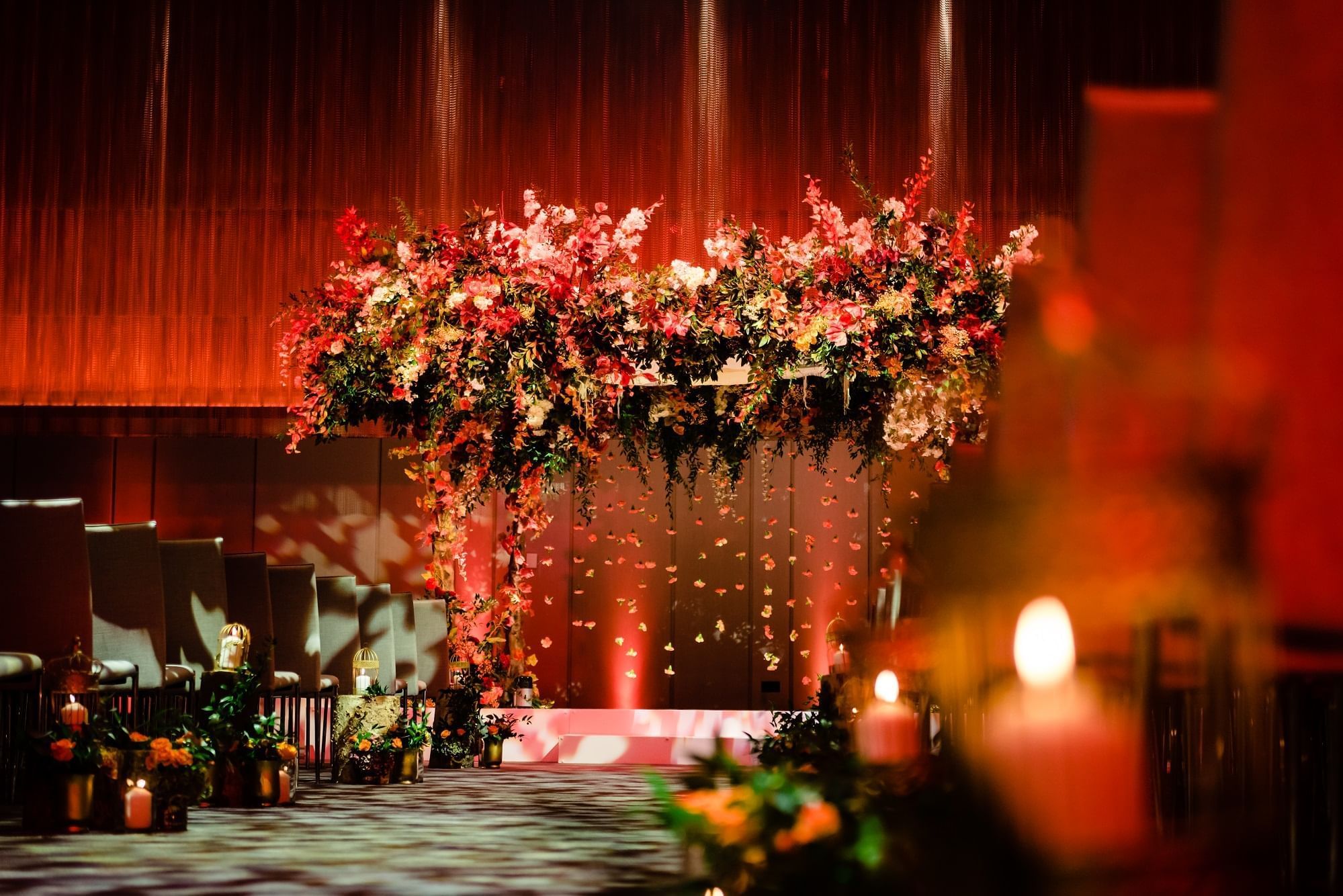 Wedding ceremony with beautiful floral archway and decorations at The Londoner Hotel