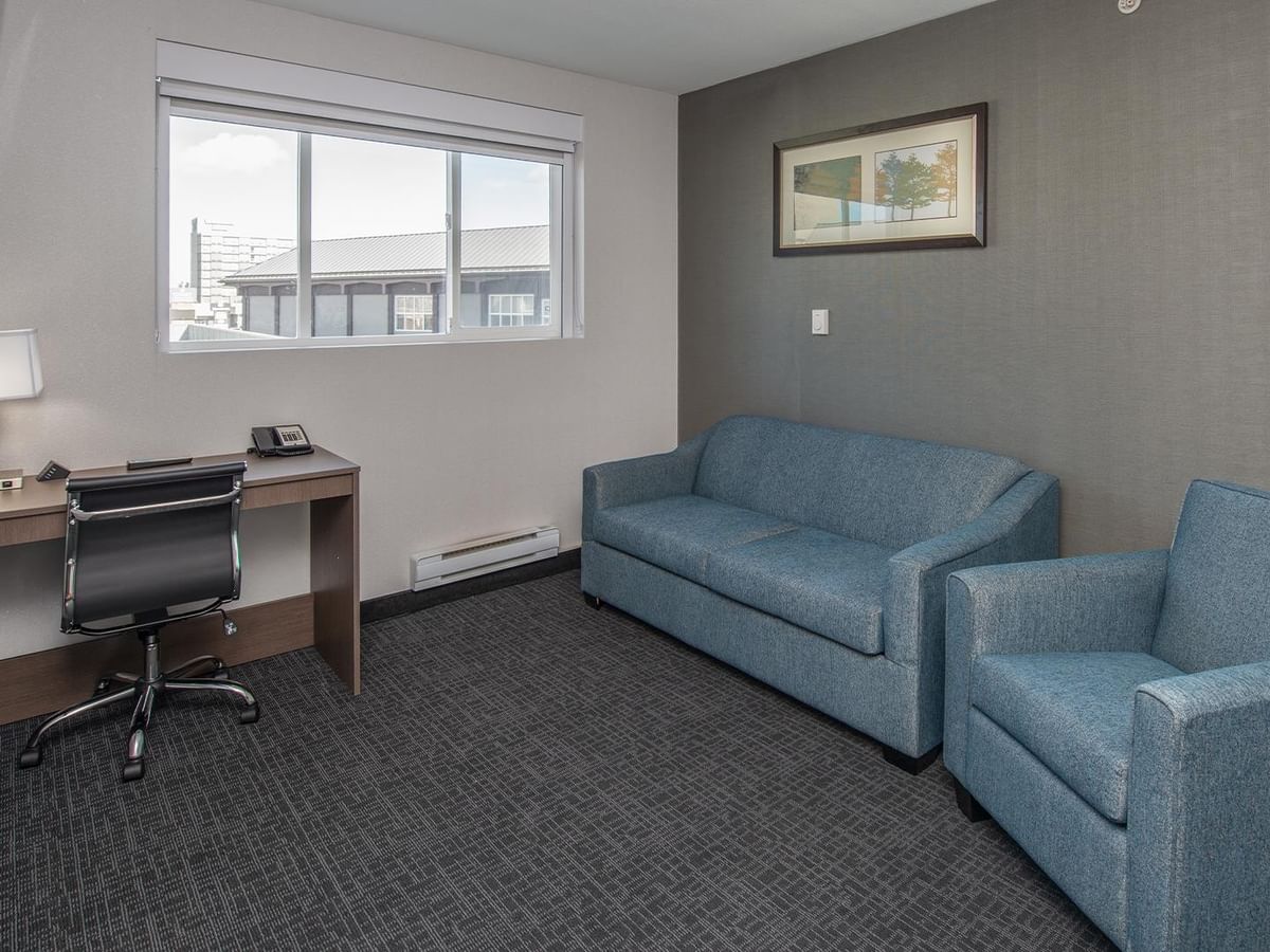 Work desk, couch and window.