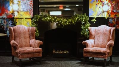 Lounge area with a firepit in a restaurant at The Eliot Hotel