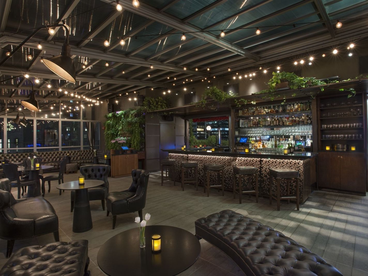 Seating area facing the liquor bar at Upstairs at The Kimberly Hotel, highlighting stylish event venues in New York City
