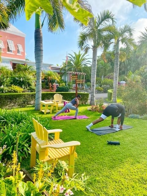 Couple doing their yoga session in the garden area at Royal Palms Hotel