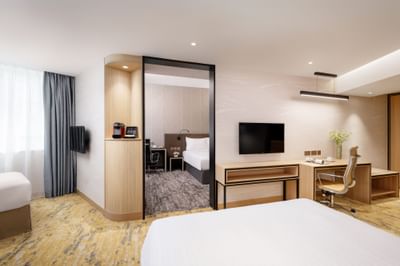 Work desk & TV facing the bed in Premier Family Quintuple Room at Park hotel Hong Kong
