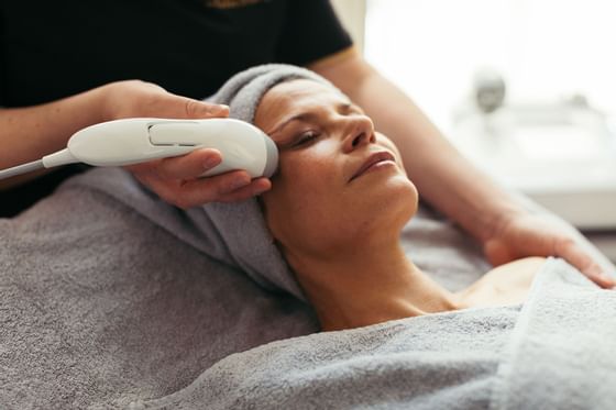 Close-up of a lady receiving a skin treatment at Liebes Rot