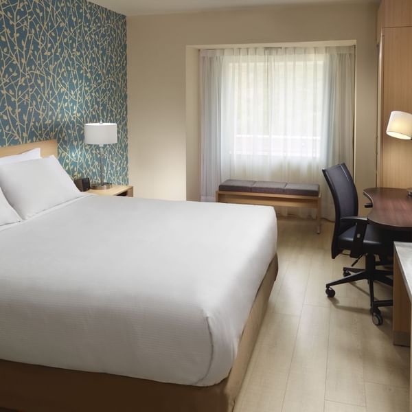 King bed & working desk in Master Suite 1 King at One Hotels