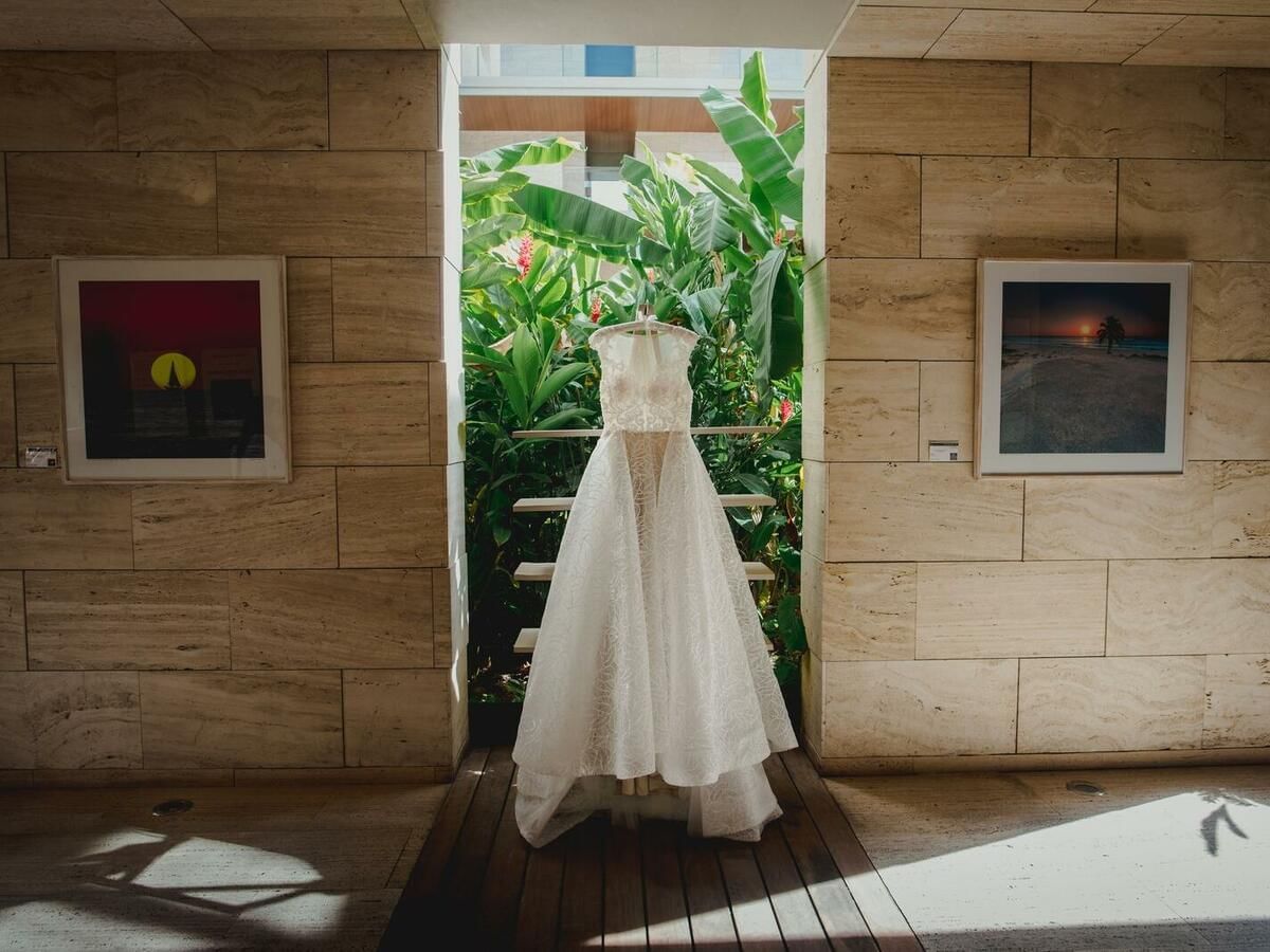 Wedding gown hung on the window at Live Aqua Beach Resort