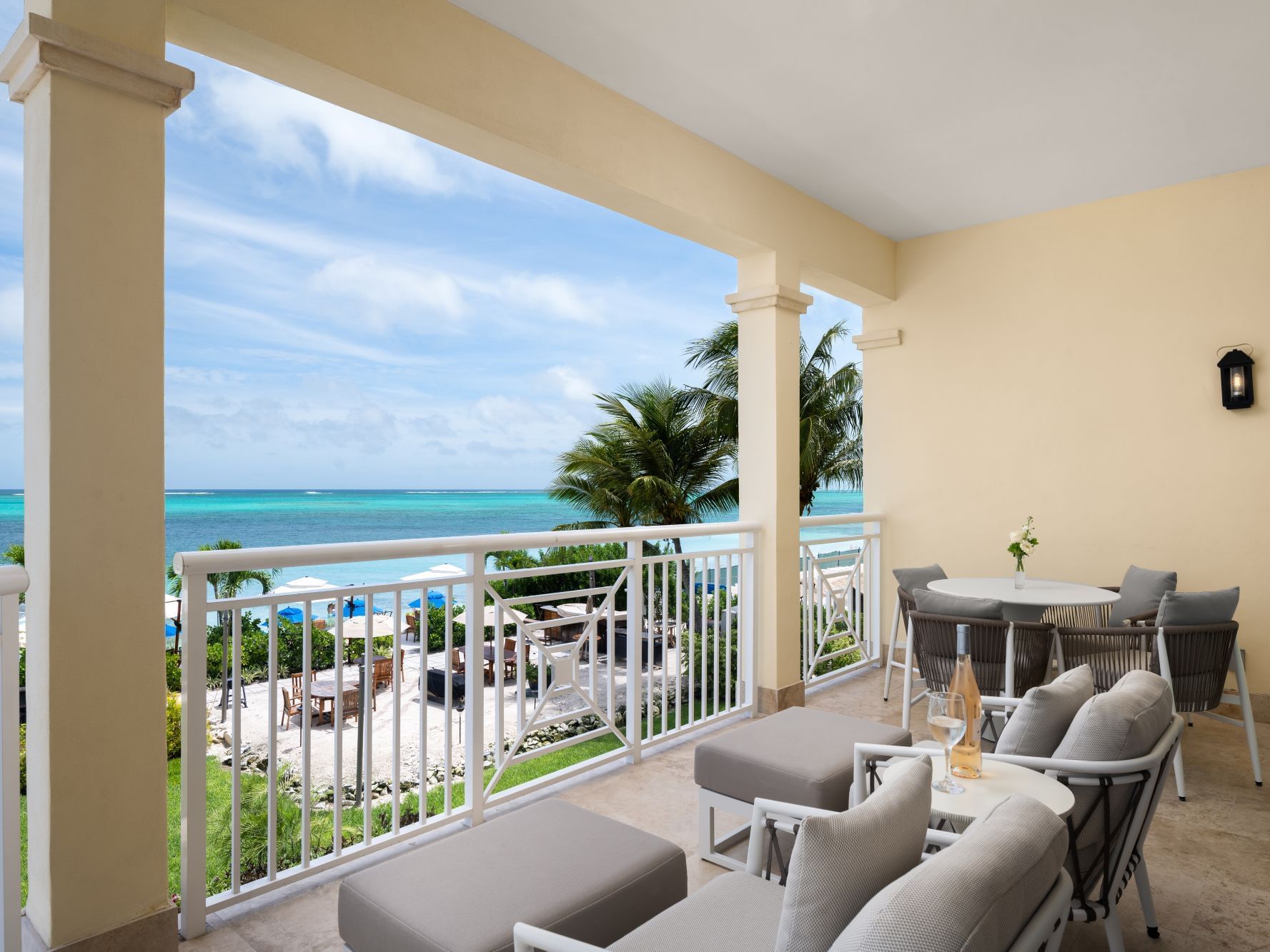2 Bedroom Deluxe Oceanfront balcony seating area overlooking ocean at Windsong Resort On The Reef
