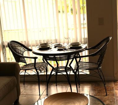 Dining table with culinary in Royal Palms Suite at Ocean Lodge Boca Raton