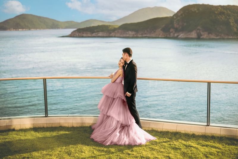A couple posing for wedding photos at Fullerton Ocean Park Hotel Hong Kong