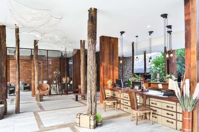 Reception with wooden interior design at U Hotels & Resorts