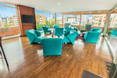 The indoor chilling area at the rooftop with couches